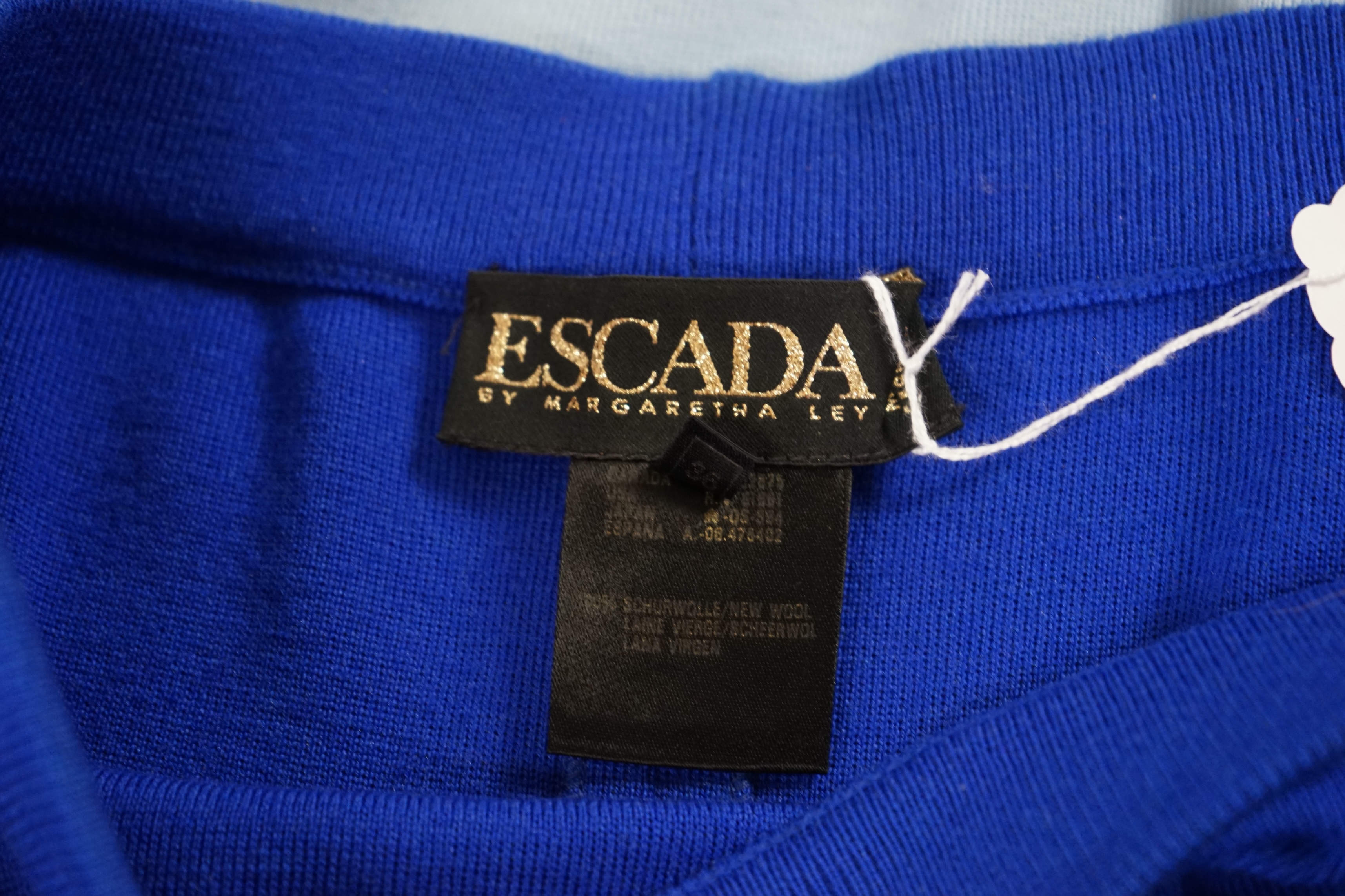 Two Escada knitted skirts. Proceeds to Happy Paws Puppy Rescue